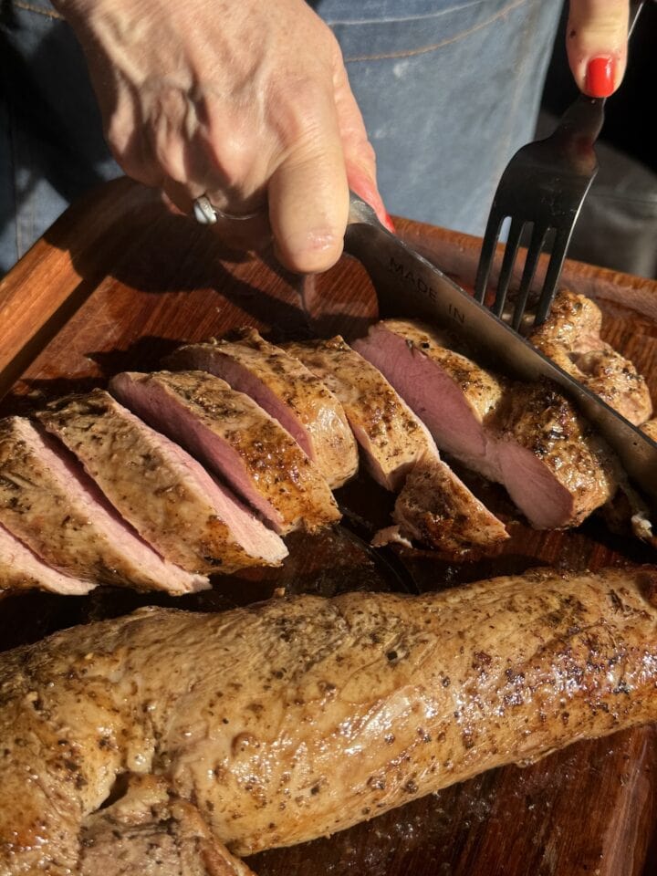 a photo of teri slicing pork loin