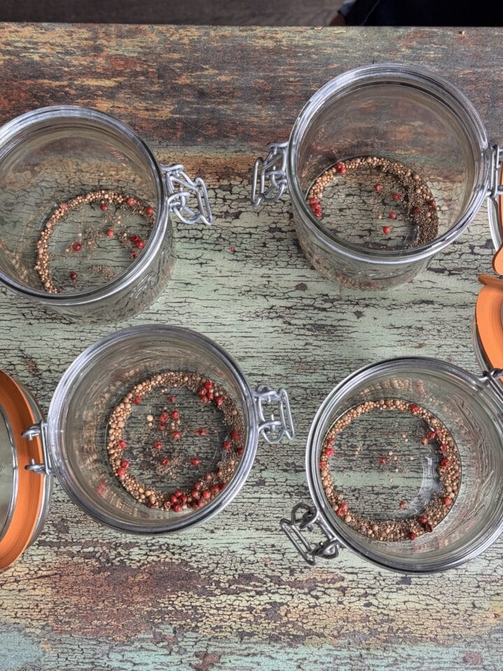jars with spices in the bottom of them