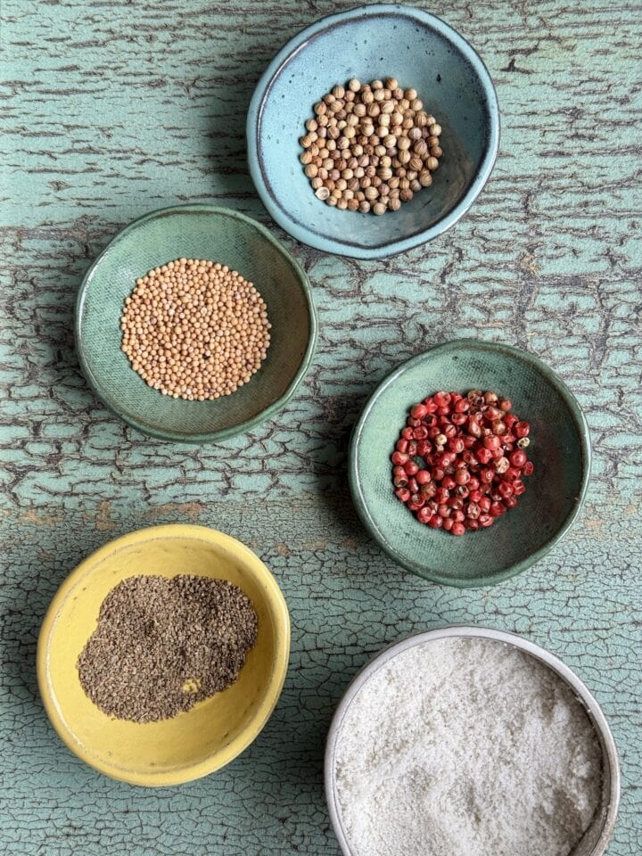 the spices for refrigerator pickles in small bowls