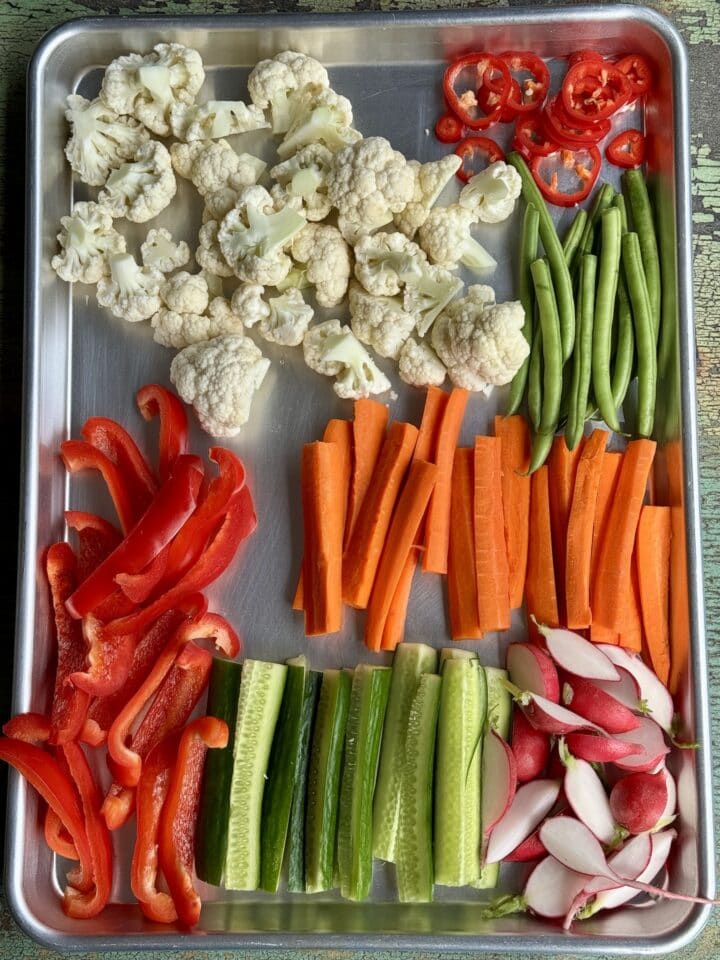 cut vegetables on a baking sheet