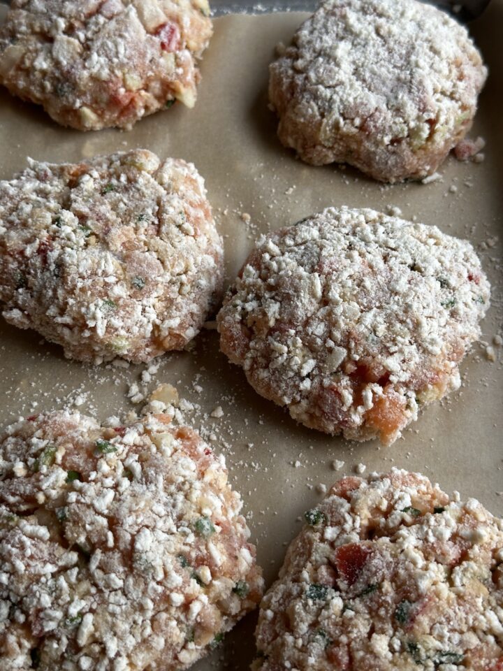 salmon burgers with flour and panko on outside