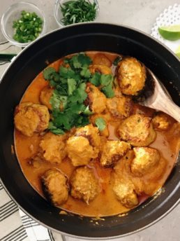 Chicken Meatballs in Red Curry in a large pan