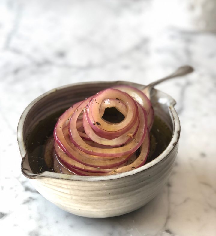 Marinated Onions in a white bowl