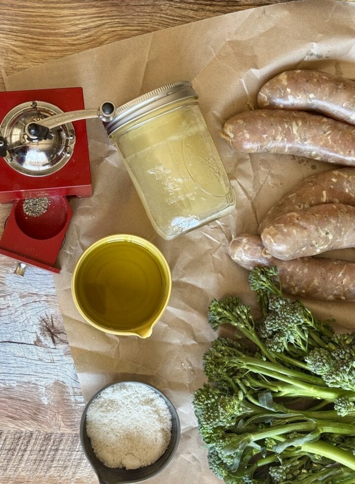 ingredients for sheet pan sausage and potatoes on a piece of butcher paper