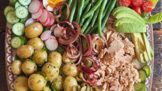 a photo of tuna nicoise salad on a large platter
