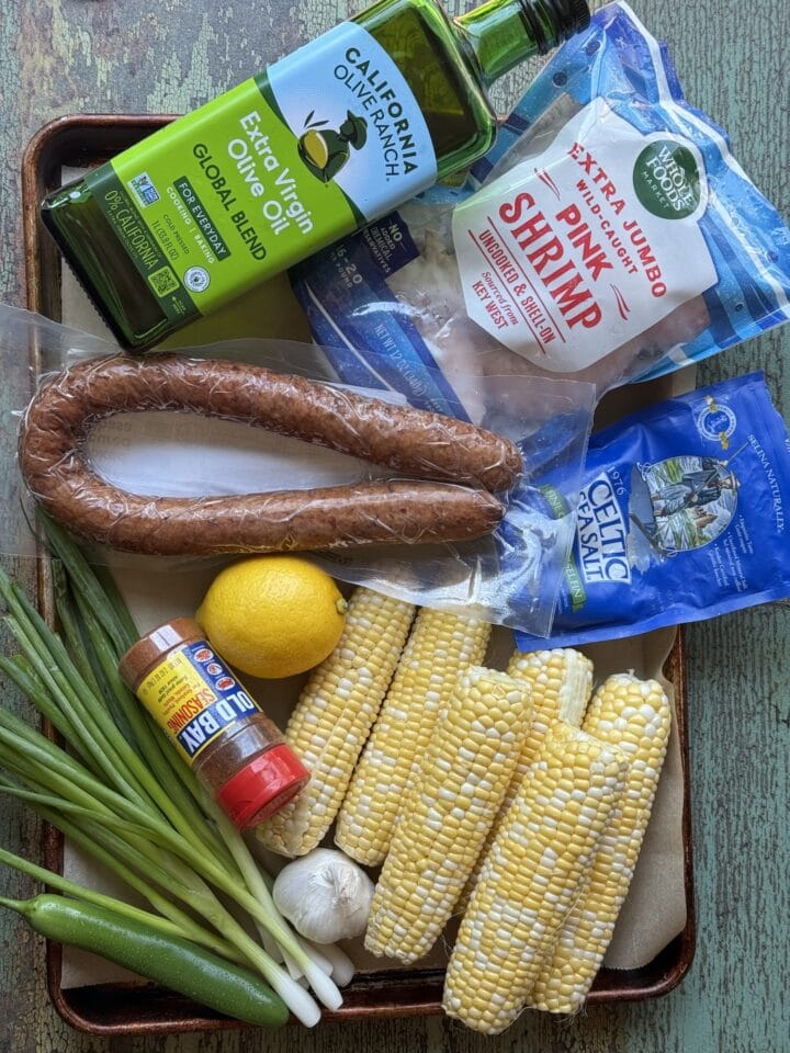ingredients for shrimp and chorizo with corn on a sheet pan