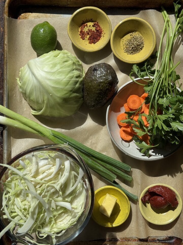 the ingredients for spicy chicken soup on a sheet tray