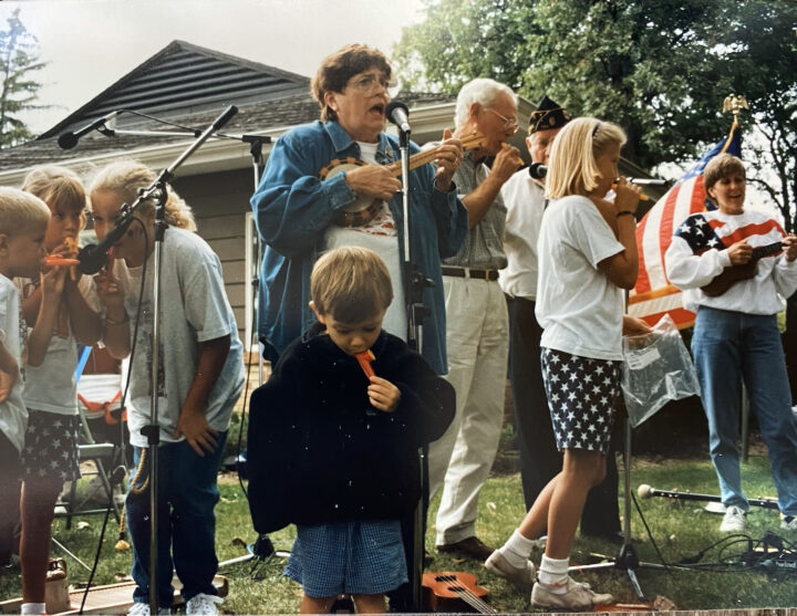 a photo of a family together singing