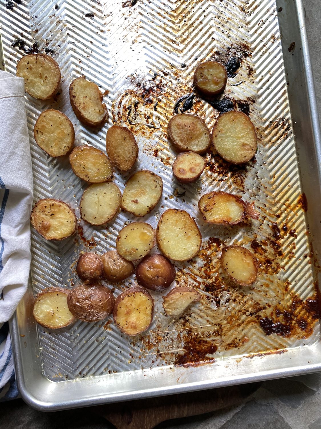 sliced potatoes on a baking sheet