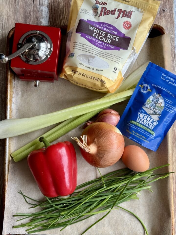 ingredients for white fish cakes on a baking sheet