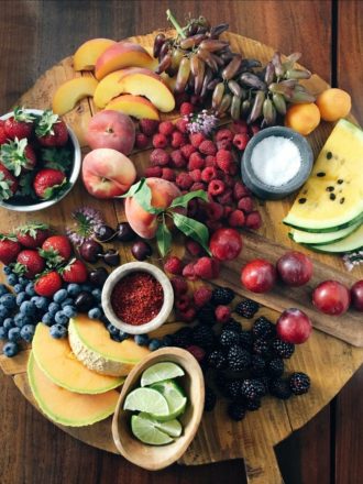 wooden board with summer fruits