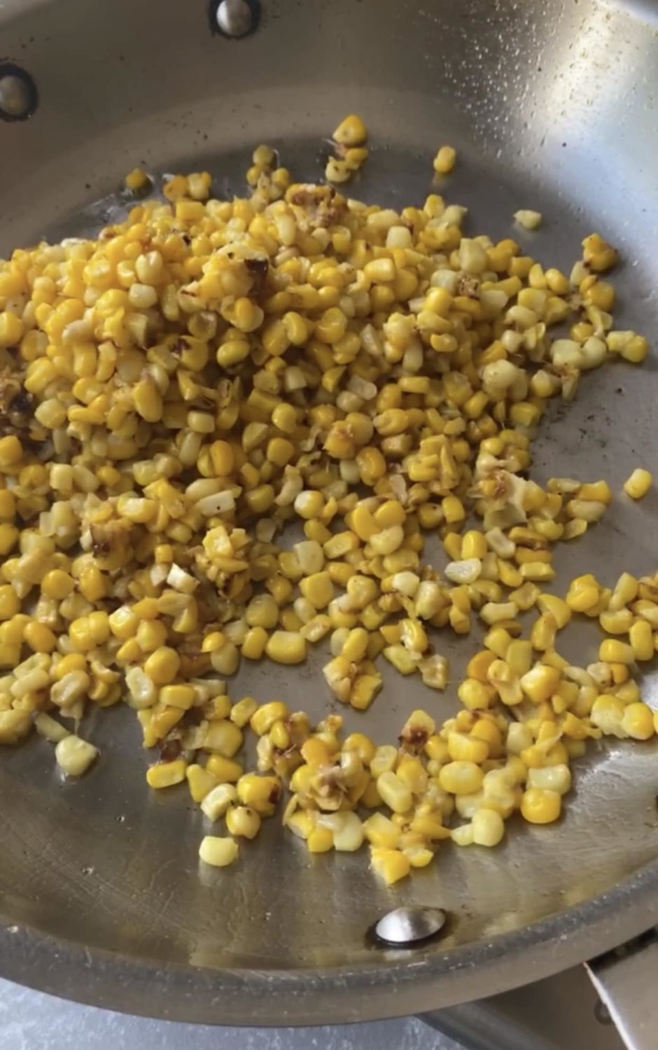 corn sauteed in a pan