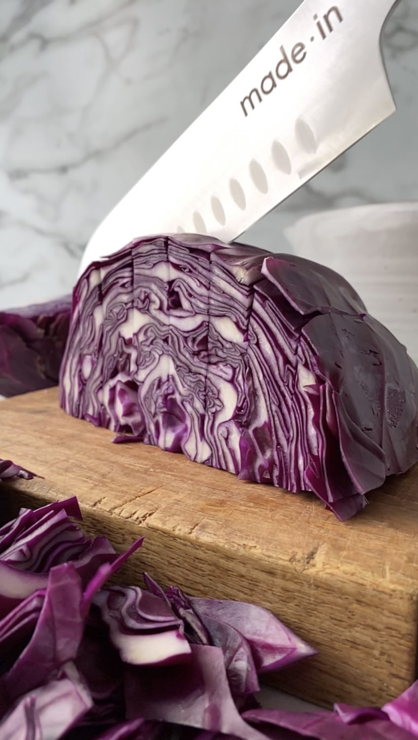 santoku knife cutting cabbage