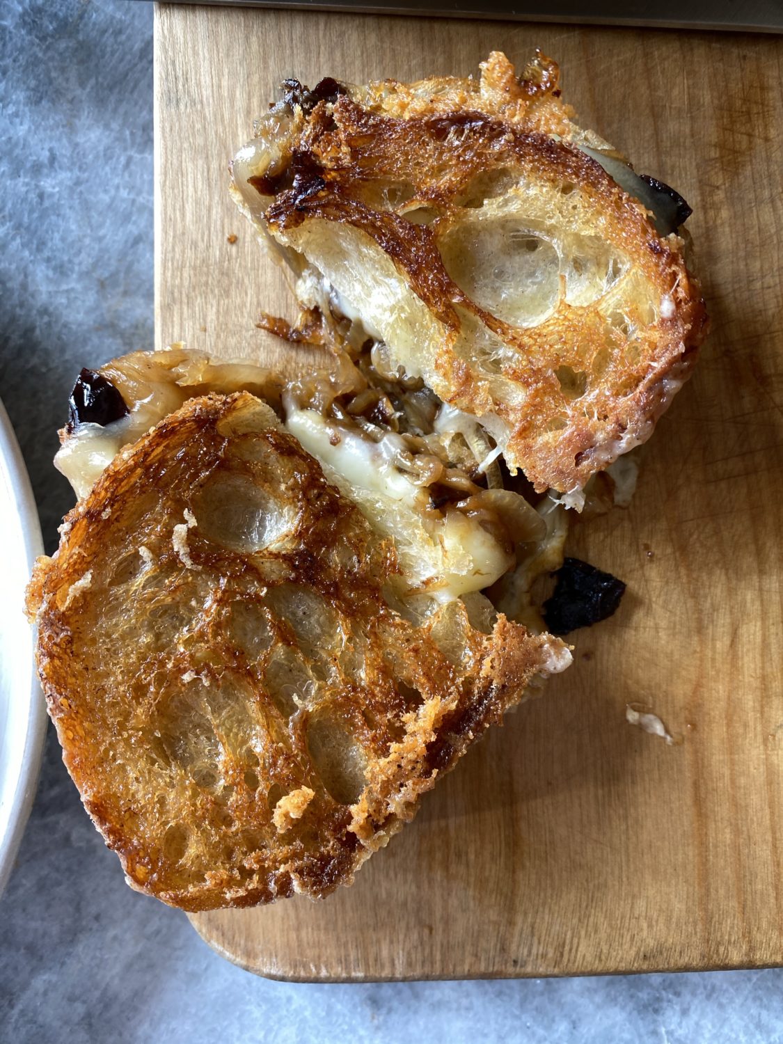 prune grilled cheese sandwich on a cutting board