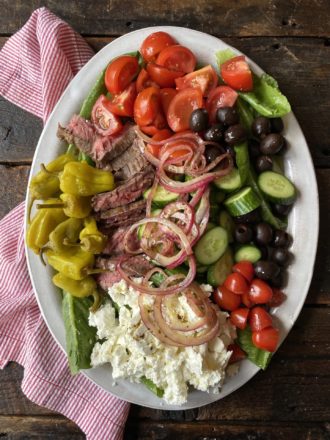 greek steak salad on nocrumbsleft platter