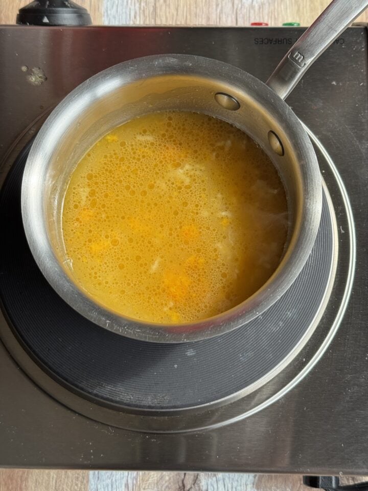 orange sauce in a small saucepan