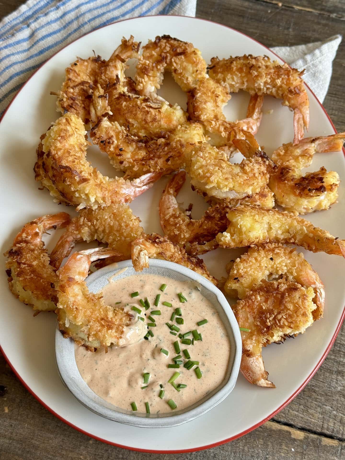 a photo of coconut fried shrimp on a platter with a dip on the side