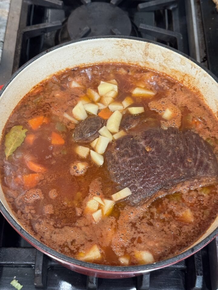 pot roast ingredients combined in a dutch oven