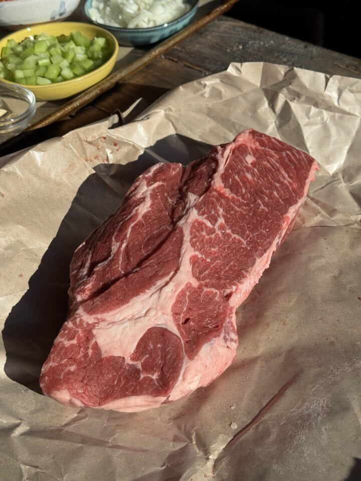 chuck roast on a piece of parchment paper