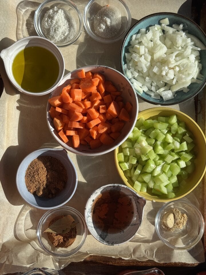 the prepped ingredients for dutch oven pot roast in small bowls