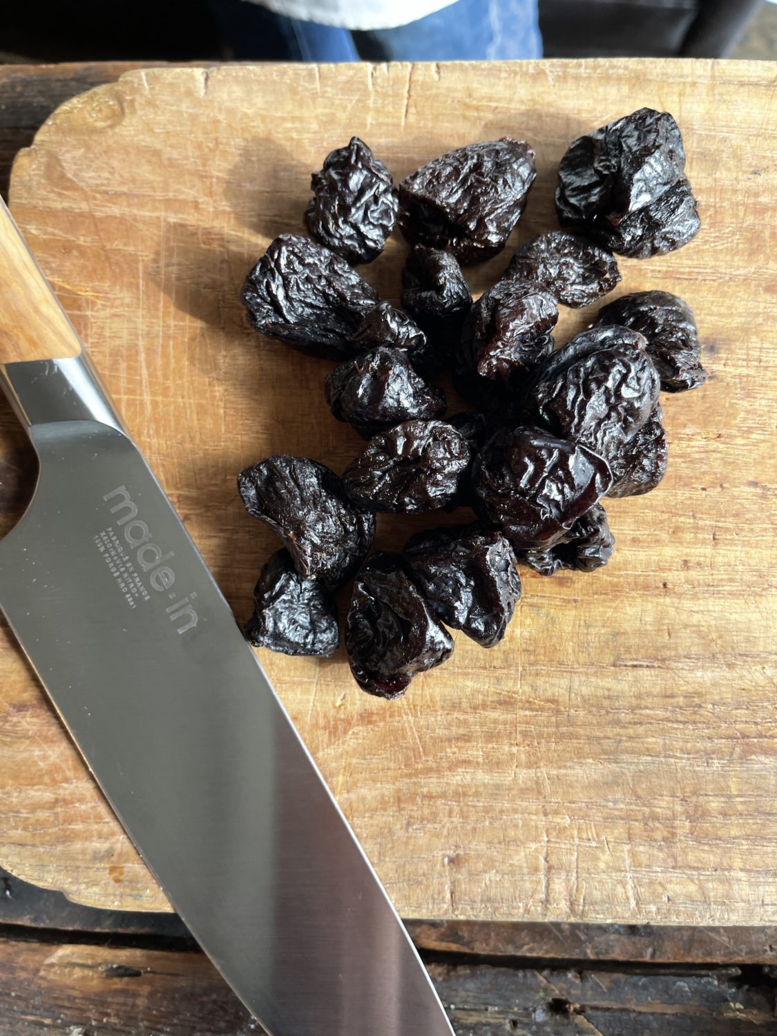 prunes on a cutting board