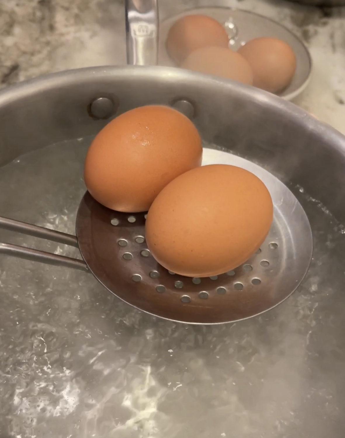 eggs going into boiling water