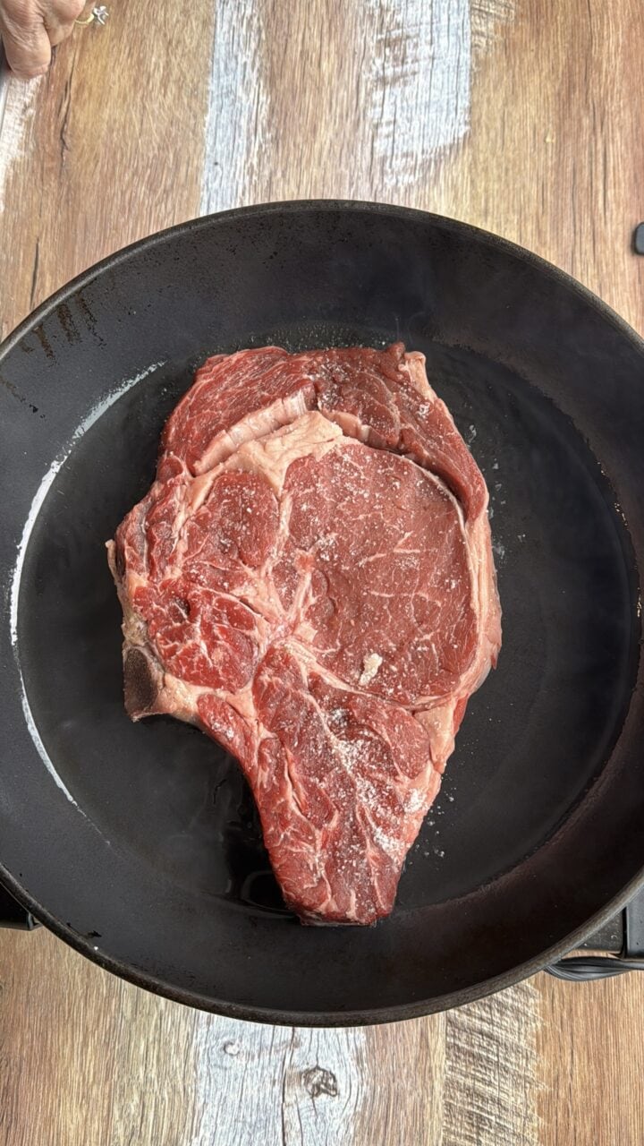 ribeye steak on a black plate