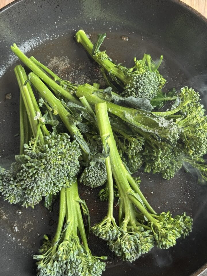 broccolini cooking in a pan