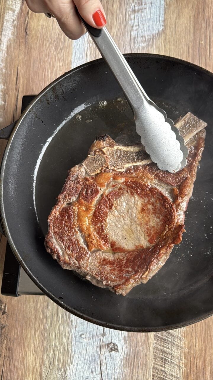ribeye steak in a cast iron skillet