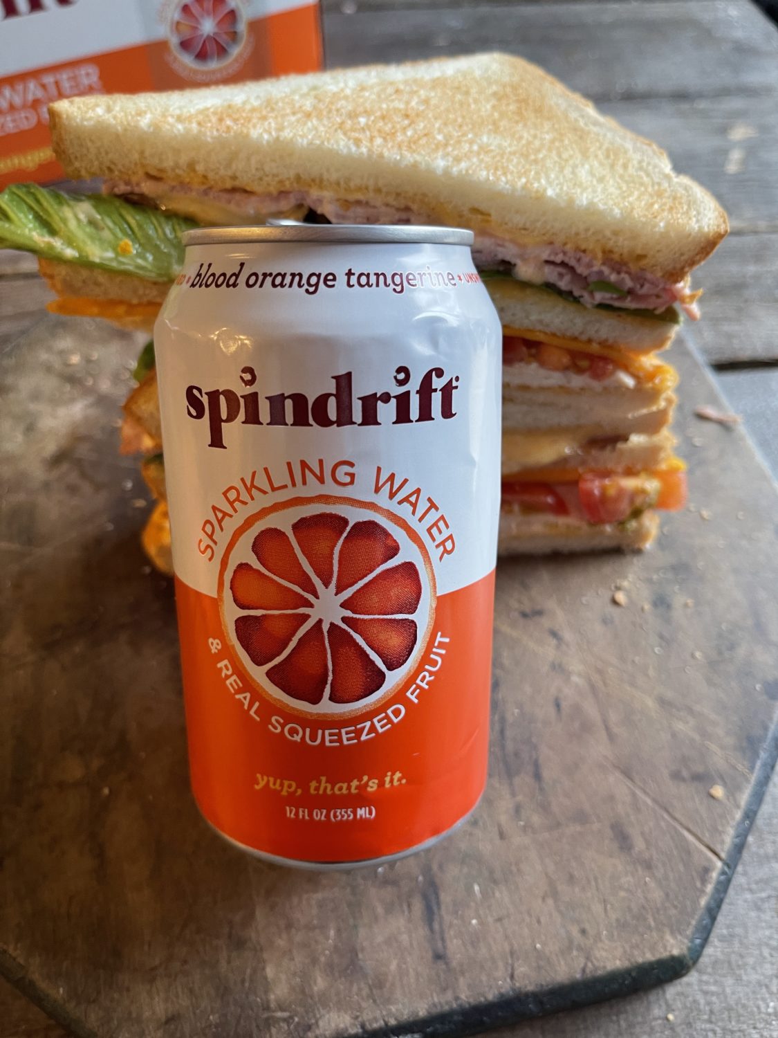 spindrift can leaning on a club