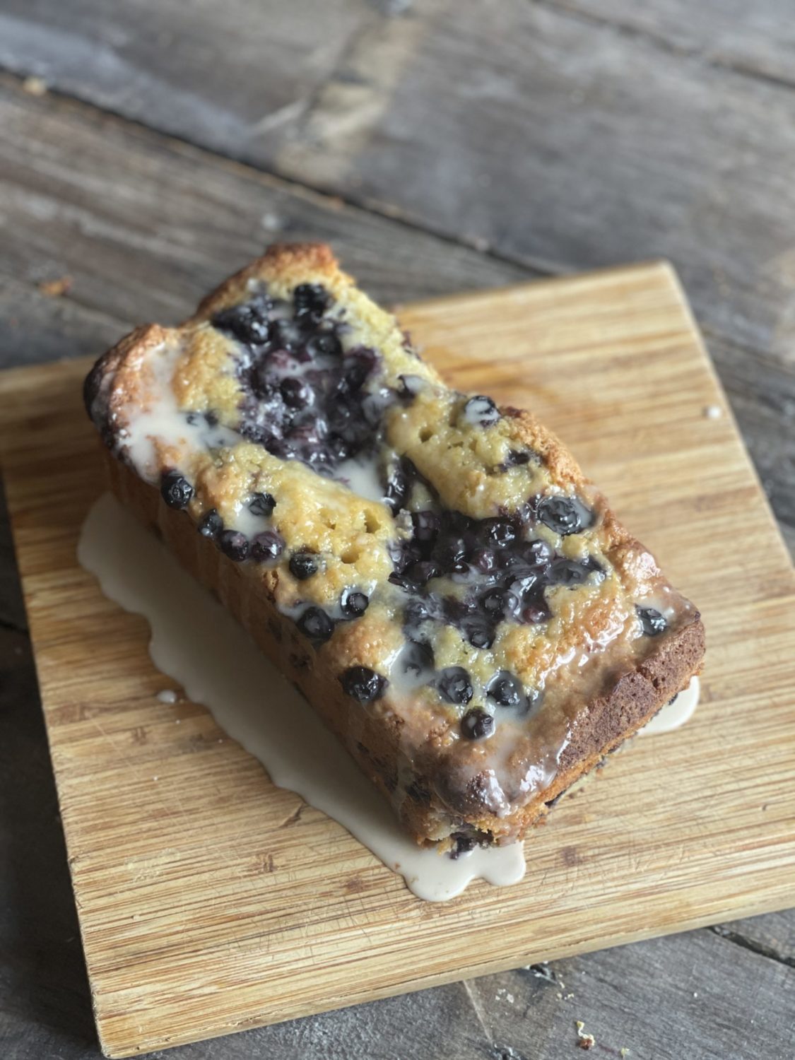 blueberry lemon loaf on a cutting board