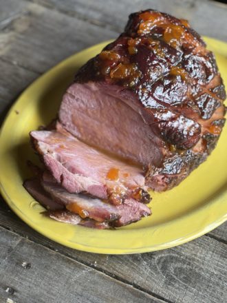 close up on sliced easter ham on a platter