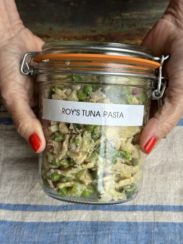 tuna pasta salad in a jar with a label on it