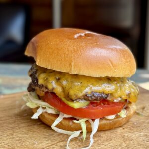smashburger on a brioche bun on a cutting board