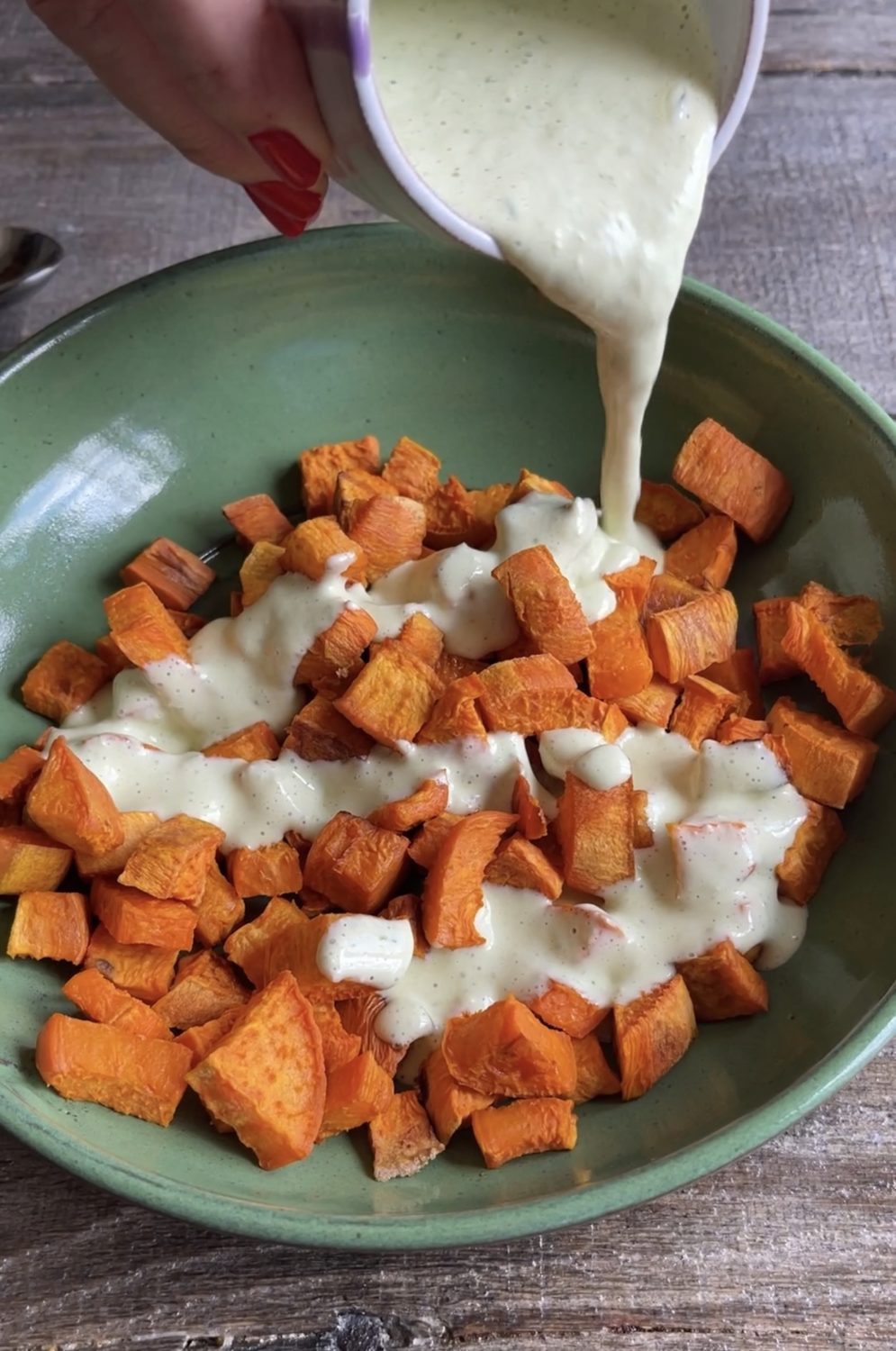 dressing poured over the sweet potatoes