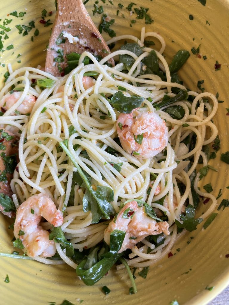 grilled shrimp pasta in a yellow bowl