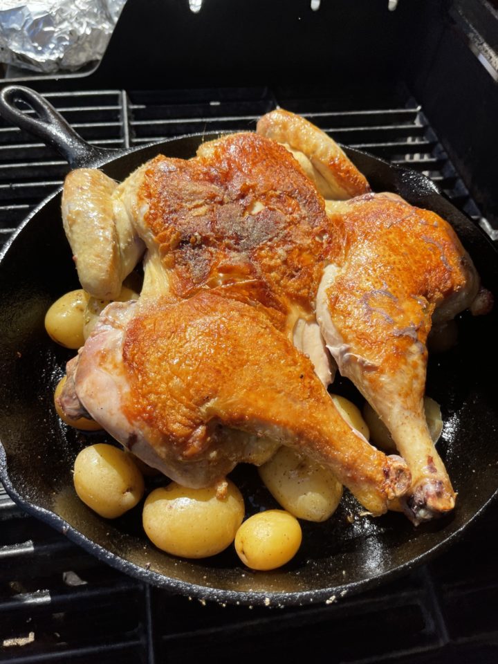 chicken on the grill with potatoes
