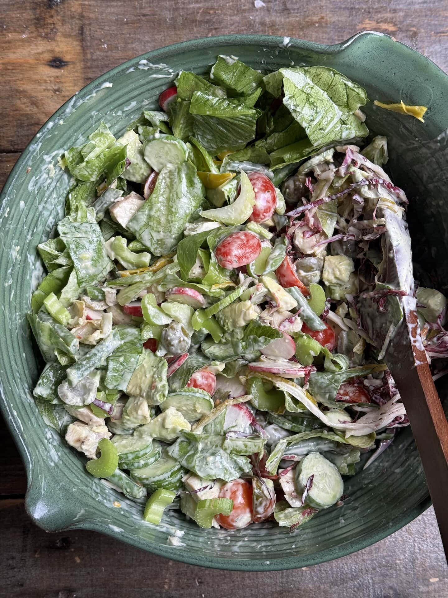 a photo of sunday summer salad in a green bowl