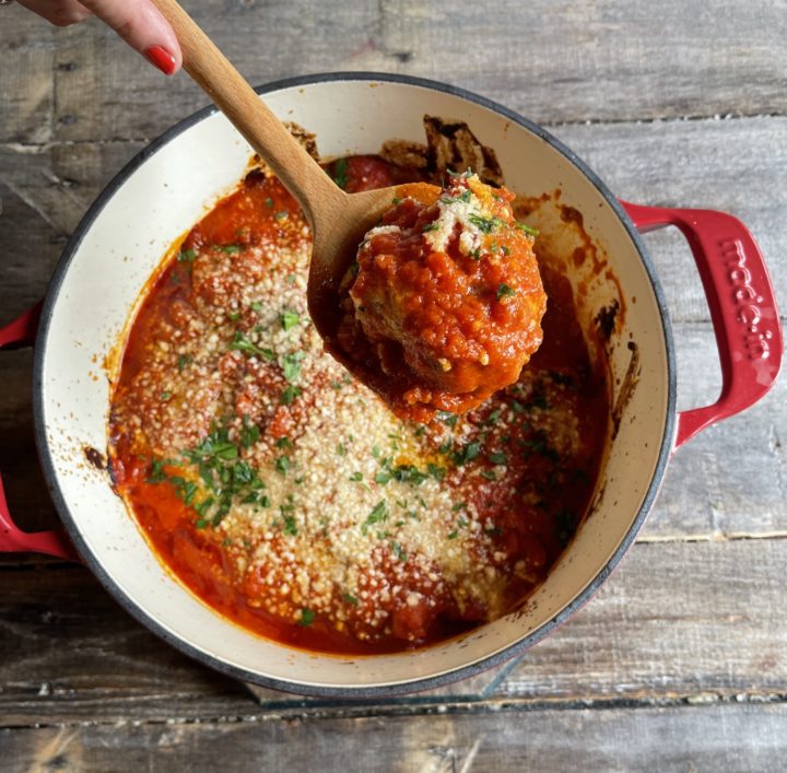 chicken meatball coming out of a dutch oven