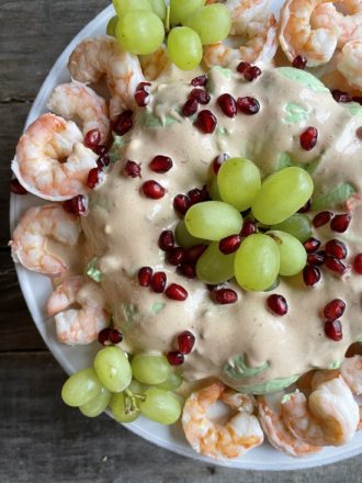 overhead view of buffet salad with shrimp and grapes
