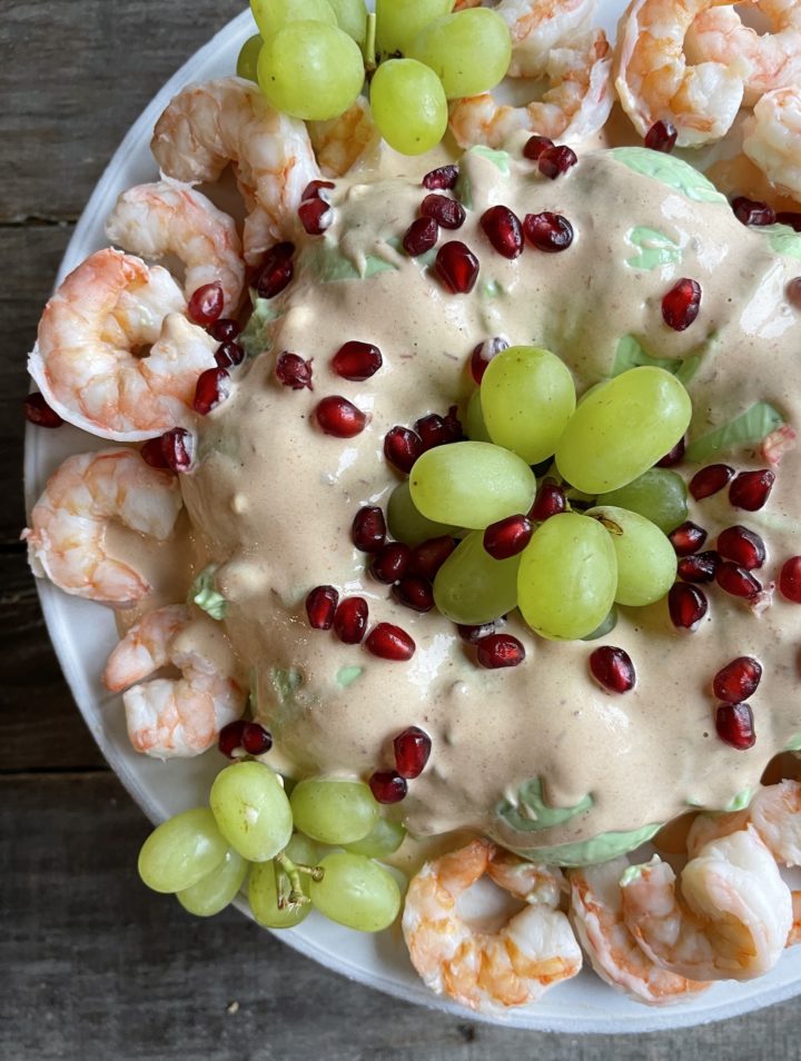 overhead view of buffet salad with shrimp and grapes
