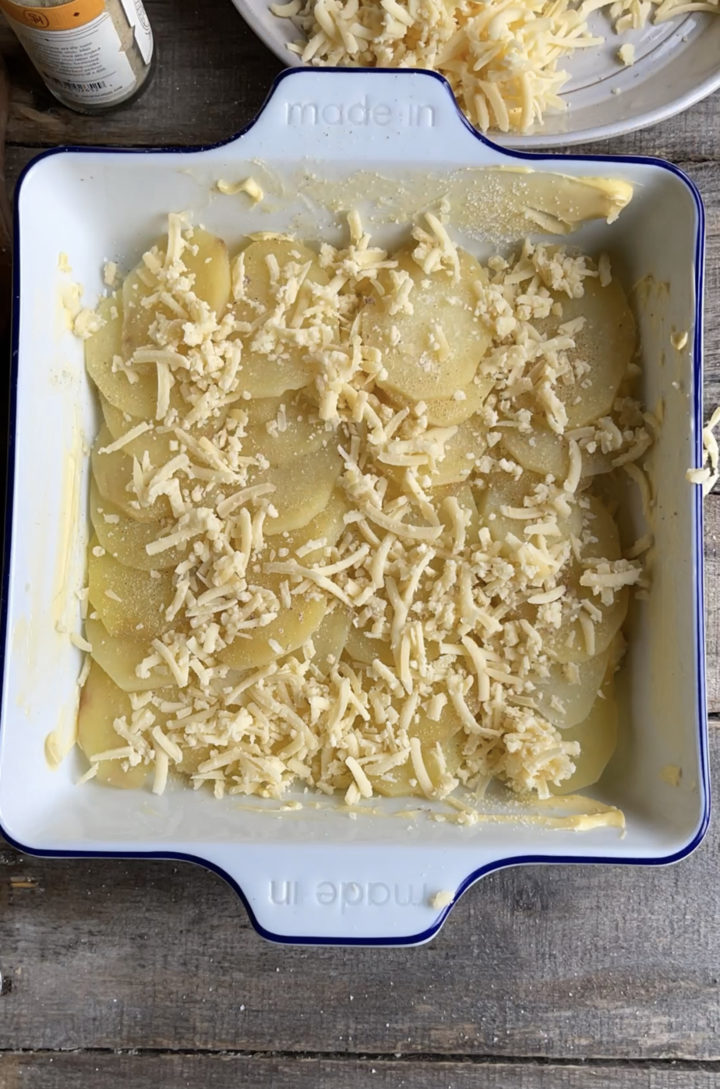 potatoes and cheese in a baking dish