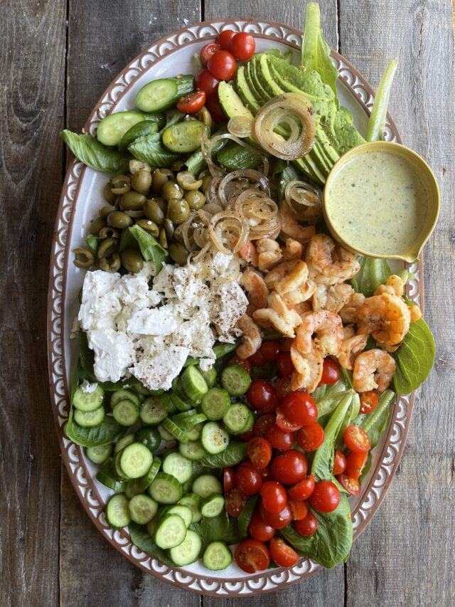 Platter ready to serve of Shrimp Greek Salad.
