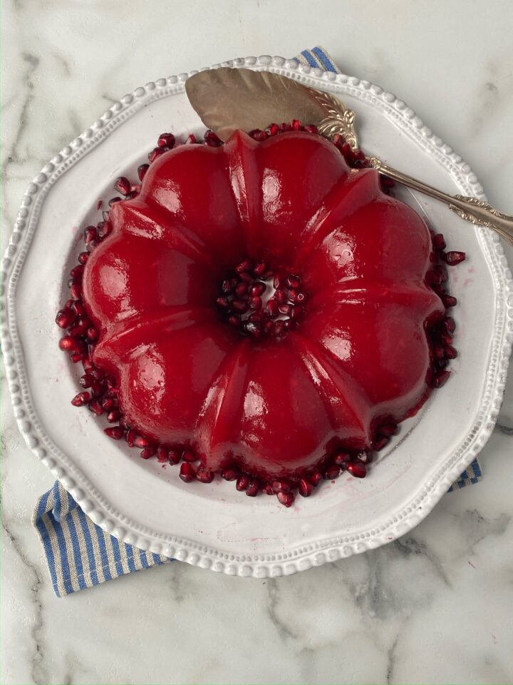 jello on serving dish with berries around it