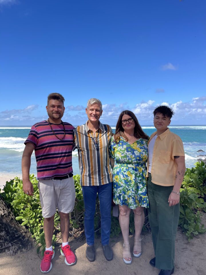 Teri & family taking photo near ocean
