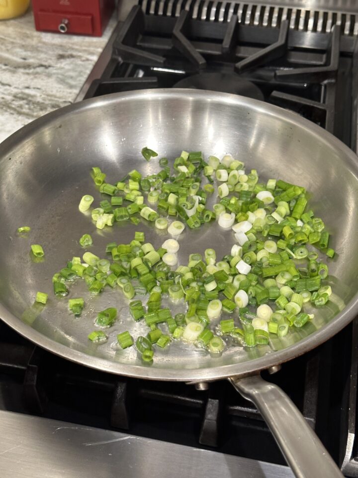 Sautee the green onions.