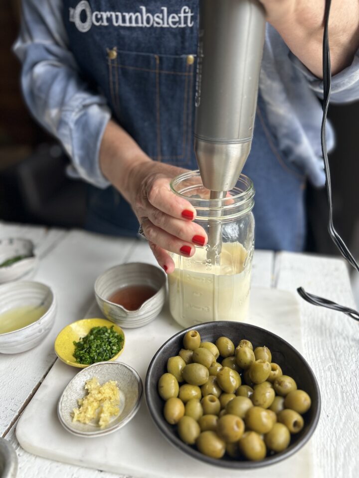 Start by adding mayo to the jar.