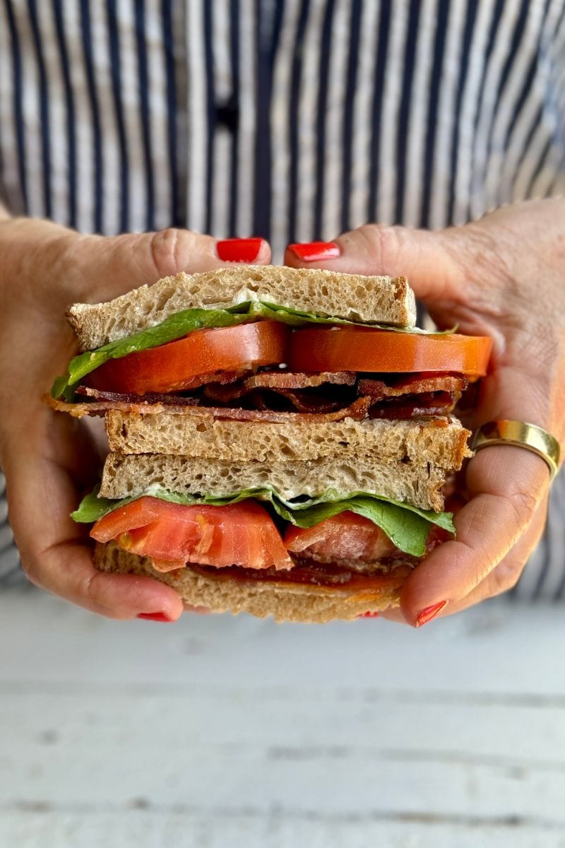 Teri's hands holding a blt