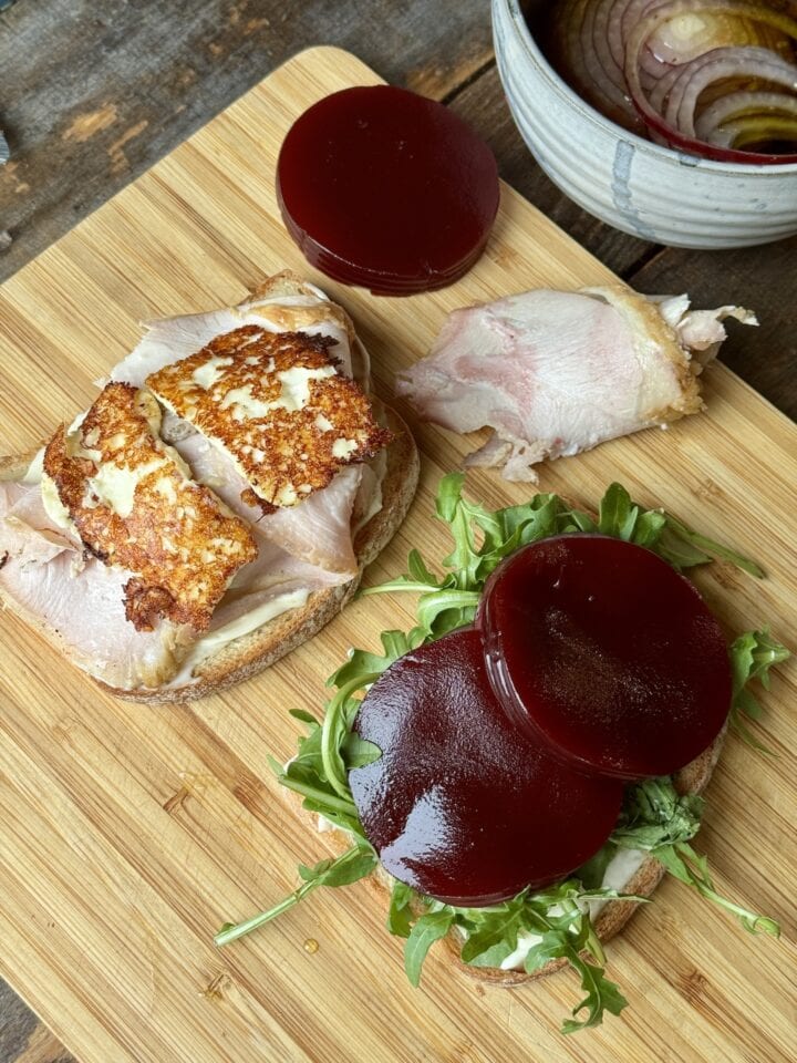 a photo of feta and cranberry sauce added to the open face sandwich