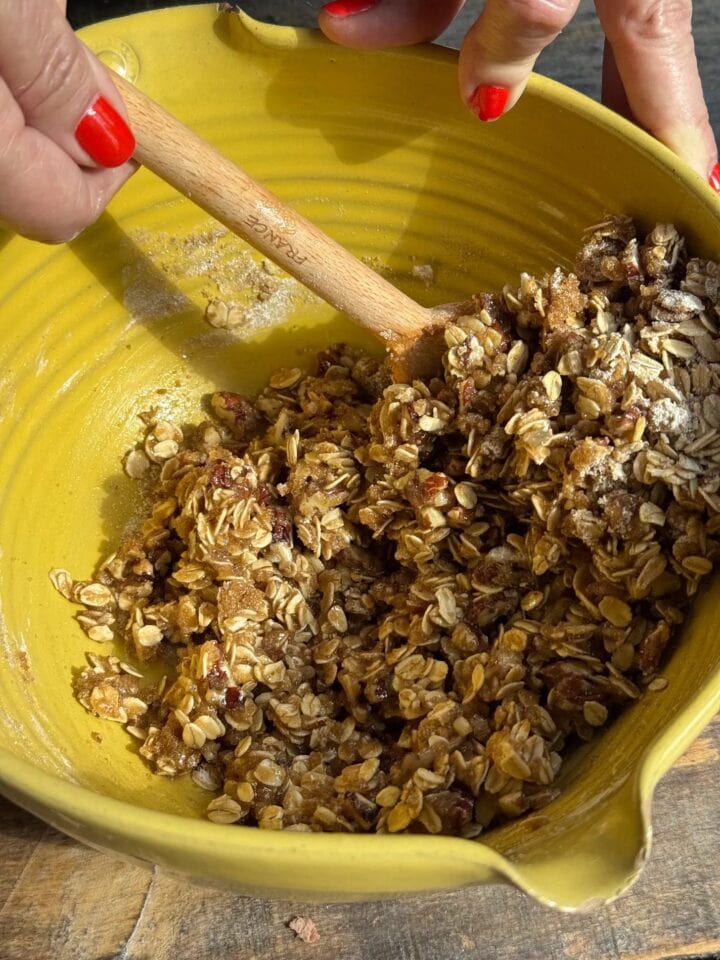 a photo of the oat mixture in a bowl being stirred